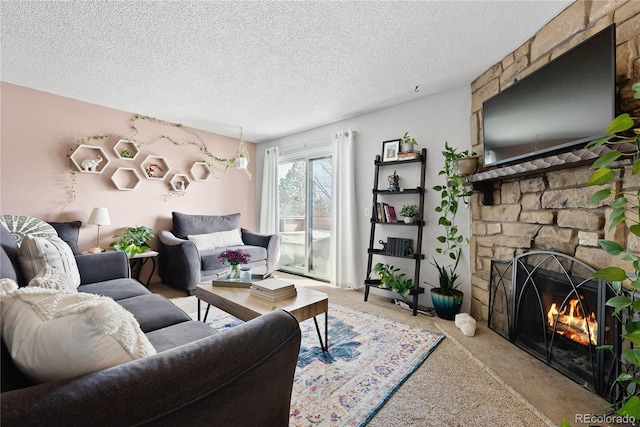 209 Wright St Unit 204, Lakewood, CO 80228 - living room with light carpet, a fireplace, and a textured ceiling