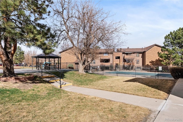 209 Wright St Unit 204, Lakewood, CO 80228 - view of community featuring a gazebo, a swimming pool, a yard, and fence