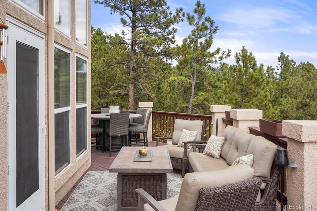 wooden deck with an outdoor hangout area