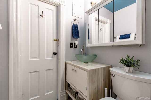 bathroom with vanity and toilet