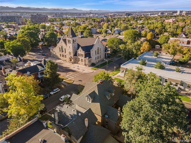 birds eye view of property with a mountain view