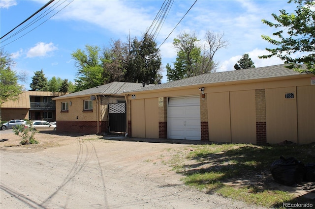 garage featuring driveway