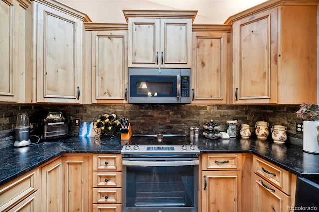 kitchen featuring tasteful backsplash, stainless steel appliances, and light brown cabinets