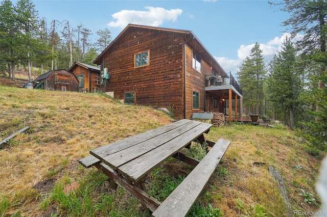 view of property exterior featuring a balcony