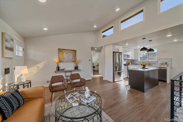 living room with sink and dark hardwood / wood-style flooring