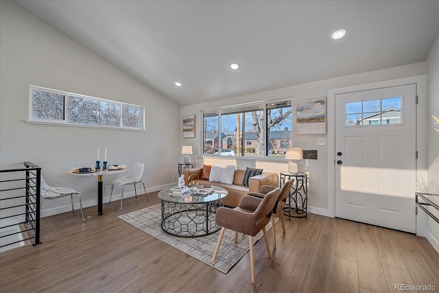 living room featuring hardwood / wood-style floors and vaulted ceiling