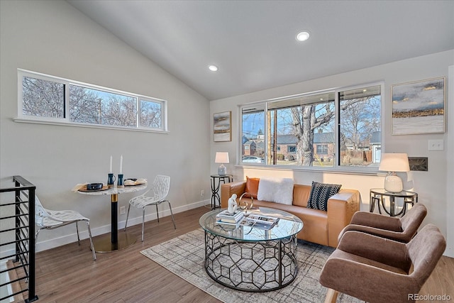 living room featuring hardwood / wood-style floors and lofted ceiling