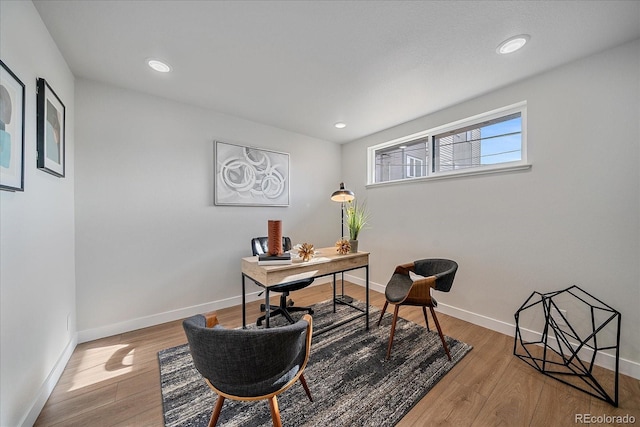 home office with wood-type flooring