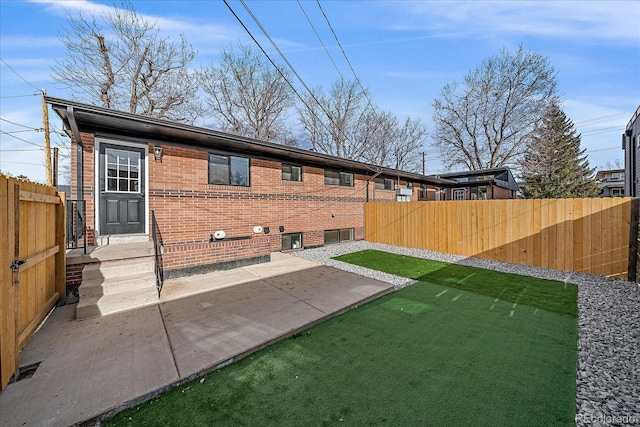 rear view of property featuring a patio