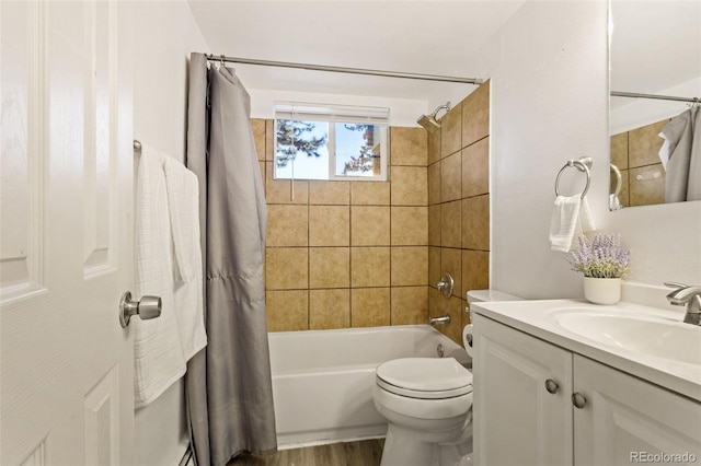 full bathroom with vanity, wood-type flooring, shower / bath combo, and toilet