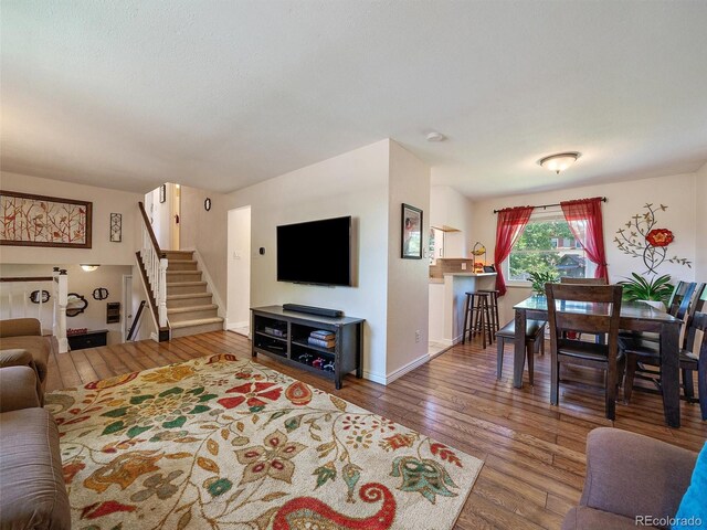 11399 Kendall St, Westminster, CO 80020 - living area with stairs and hardwood / wood-style floors
