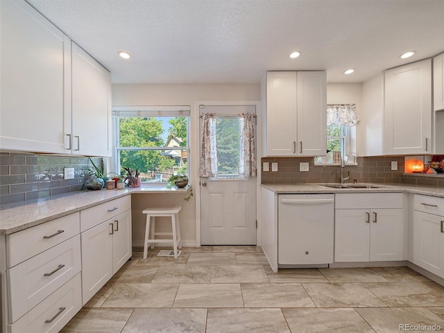 11399 Kendall St, Westminster, CO 80020 - kitchen with dishwasher, white cabinets, decorative backsplash, and recessed lighting
