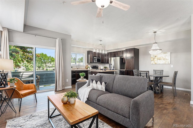 15800 E 121st Ave Unit 3, Brighton, CO 80603 - living area with a chandelier, dark wood-style floors, and a ceiling fan