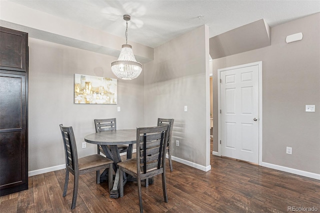 15800 E 121st Ave Unit 3, Brighton, CO 80603 - dining area with dark wood-style flooring and a chandelier