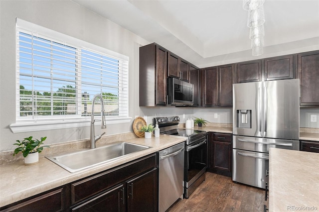 15800 E 121st Ave Unit 3, Brighton, CO 80603 - kitchen featuring stainless steel appliances, light countertops, dark brown cabinets, and dark wood-style flooring
