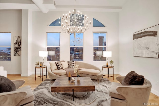 1521 Central St Unit 3C, Denver, CO 80211 - living room with a chandelier, wood finished floors, and baseboards
