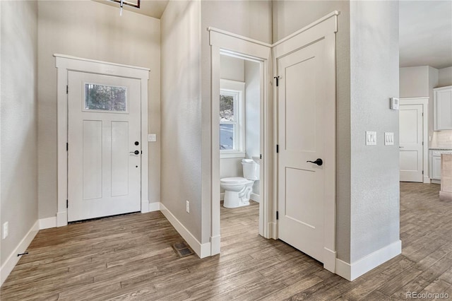 entryway with light hardwood / wood-style flooring