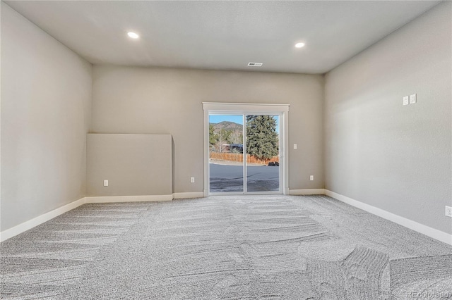 unfurnished room with carpet flooring