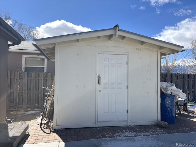 view of shed with fence