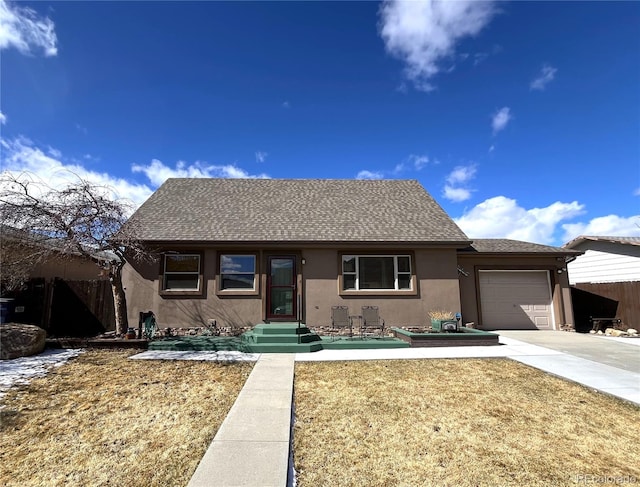 ranch-style house featuring a garage, concrete driveway, roof with shingles, fence, and stucco siding