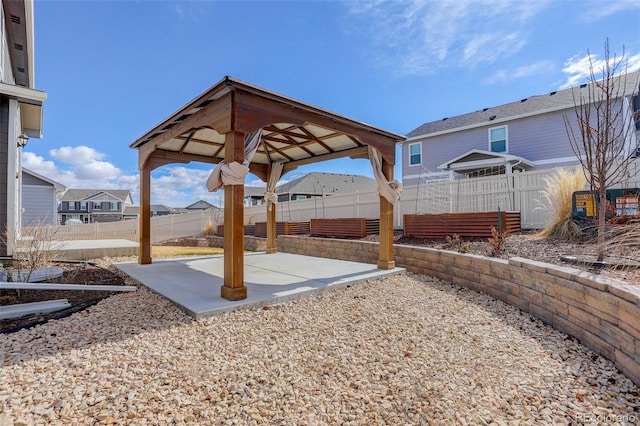 view of yard with a gazebo, a patio area, fence, and a residential view