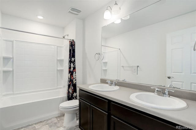 bathroom featuring a sink, visible vents, toilet, and shower / bath combo