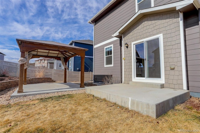 exterior space with a gazebo and fence