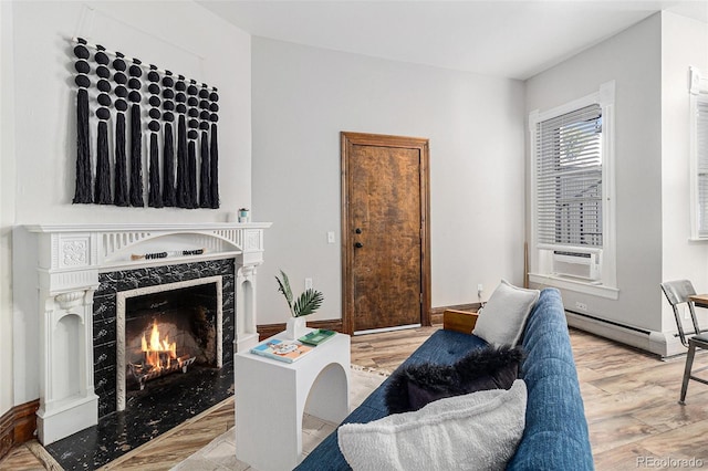 813 E 14th Ave Unit 4, Denver, CO 80218 - living room with cooling unit, wood finished floors, a baseboard radiator, and a premium fireplace