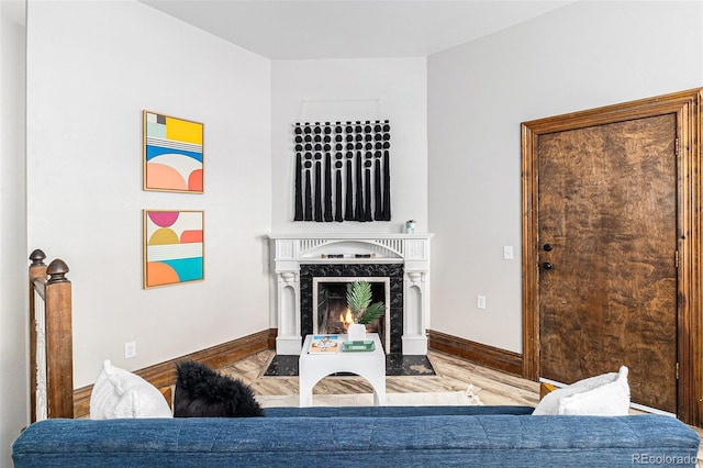 813 E 14th Ave Unit 4, Denver, CO 80218 - living area featuring a premium fireplace and wood finished floors