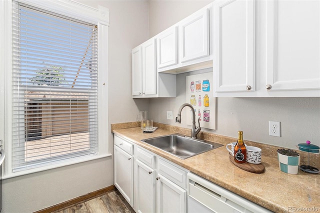 813 E 14th Ave Unit 4, Denver, CO 80218 - kitchen featuring white cabinetry, wood finished floors, light countertops, and dishwasher