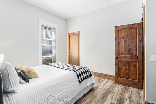 813 E 14th Ave Unit 4, Denver, CO 80218 - bedroom featuring wood finished floors and baseboards