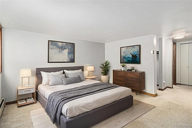813 E 14th Ave Unit 4, Denver, CO 80218 - bedroom with light colored carpet and a baseboard radiator