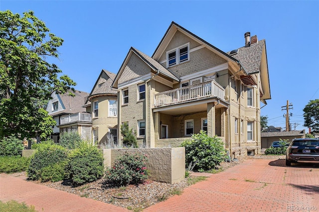 813 E 14th Ave Unit 4, Denver, CO 80218 - view of front facade featuring a balcony and a chimney