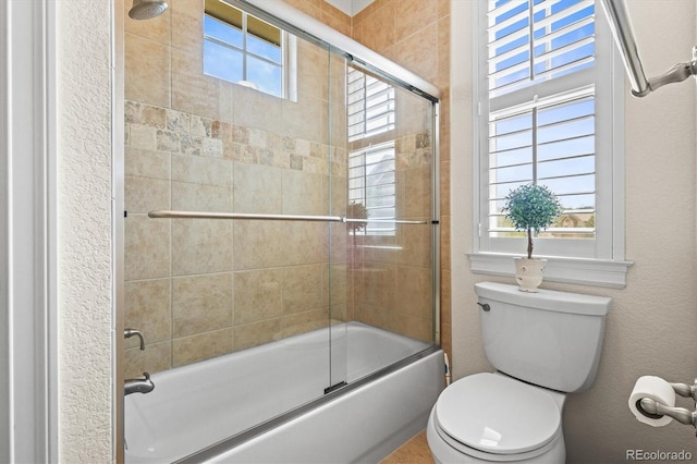 7003 S Irvington Ct, Aurora, CO 80016 - full bath featuring bath / shower combo with glass door and a textured wall