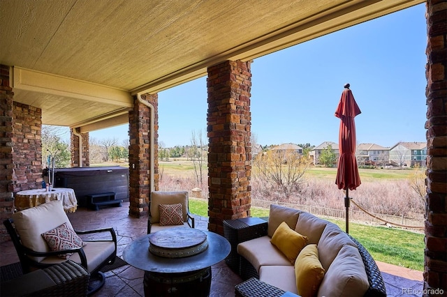 6971 S Netherland Way, Aurora, CO 80016 - view of patio with an outdoor hangout area and a hot tub