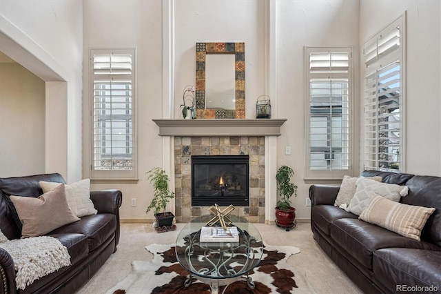 6971 S Netherland Way, Aurora, CO 80016 - living area with plenty of natural light, a tile fireplace, and carpet floors