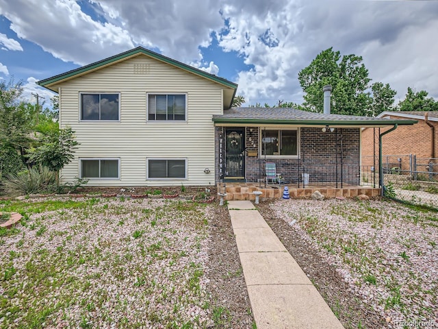 split level home featuring covered porch