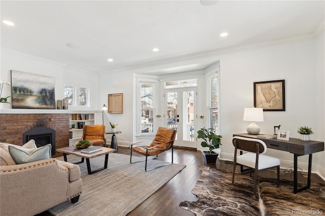 living room with a fireplace, crown molding, baseboards, and dark wood-style flooring