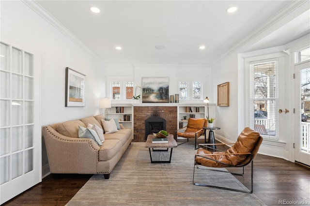 living area featuring recessed lighting, crown molding, and dark wood-type flooring