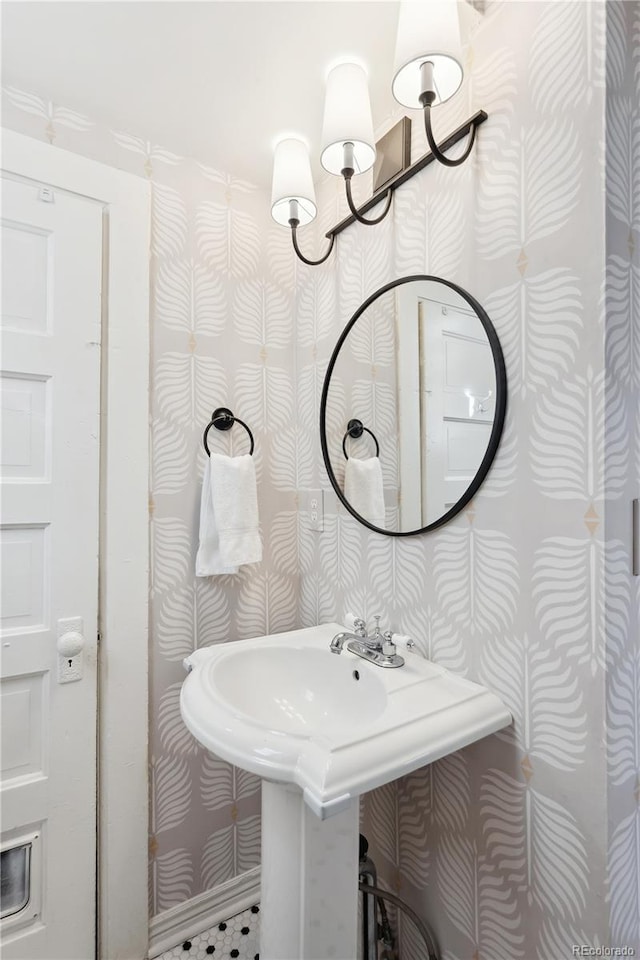 bathroom with an inviting chandelier