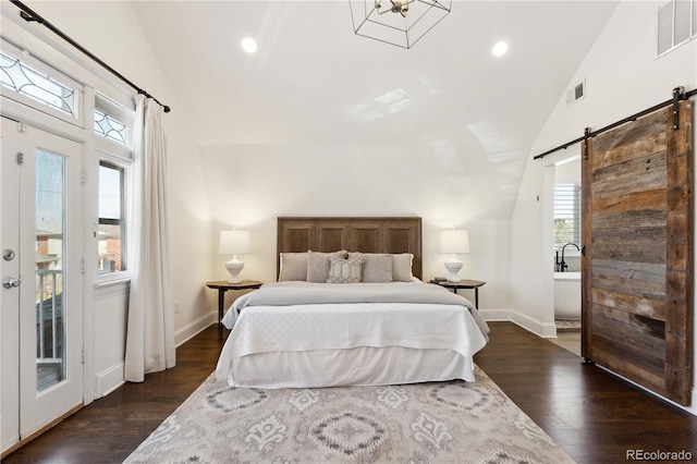 bedroom with a barn door, visible vents, lofted ceiling, and dark wood-type flooring