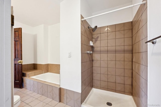 bathroom with toilet and plus walk in shower