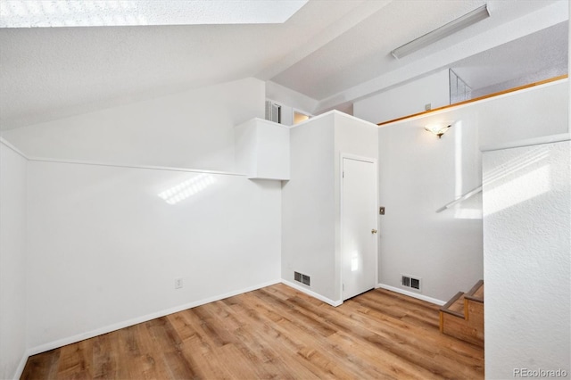 clothes washing area featuring light wood-type flooring