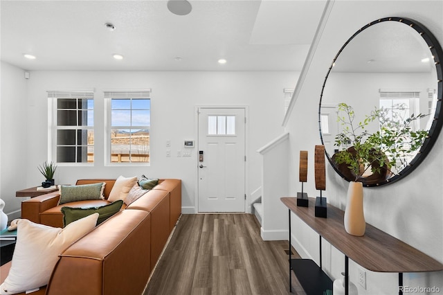 foyer featuring stairway, recessed lighting, wood finished floors, and a wealth of natural light