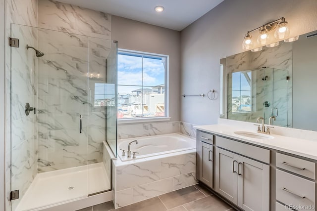 bathroom with vanity and plus walk in shower