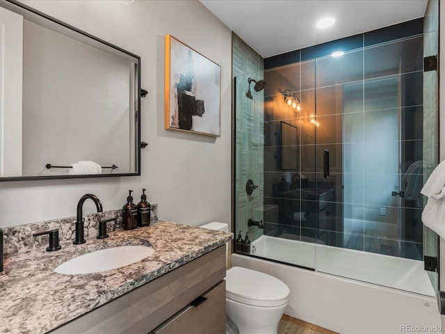 436 N Fuller Placer Rd, Breckenridge, CO 80424 - full bathroom featuring toilet, vanity, and bath / shower combo with glass door