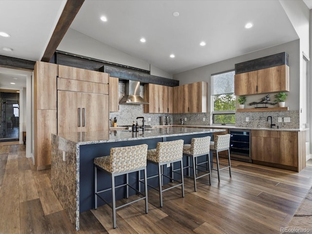 436 N Fuller Placer Rd, Breckenridge, CO 80424 - kitchen featuring wall chimney range hood, wine cooler, open shelves, decorative backsplash, and dark wood finished floors
