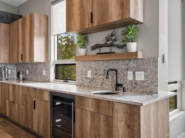 436 N Fuller Placer Rd, Breckenridge, CO 80424 - kitchen featuring beverage cooler, a sink, decorative backsplash, light stone countertops, and modern cabinets