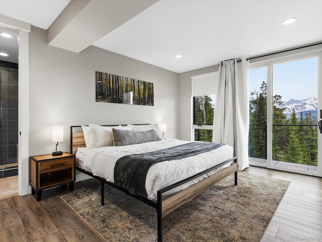 436 N Fuller Placer Rd, Breckenridge, CO 80424 - bedroom featuring wood finished floors, access to exterior, recessed lighting, and a mountain view