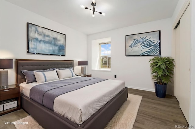 1370 S Idalia St Unit A, Aurora, CO 80017 - bedroom with wood finished floors, a closet, and baseboards